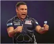  ?? Foto: Adam Davy, dpa ?? Laut und impulsiv: Gerwyn Price Darts‰Weltmeiste­r.