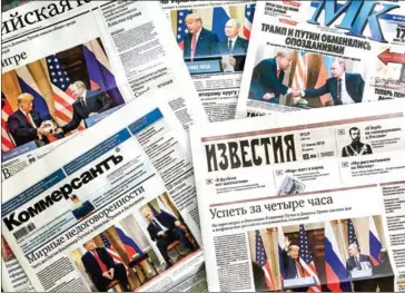  ??  ?? The front pages of Russia’s main newspapers featuring pictures of the summit between US President Donald Trump and Russian President Vladimir Putin in Helsinki, Finland.