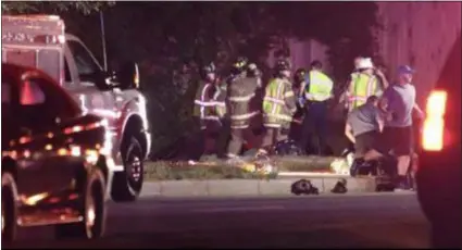  ?? SUBMITTED PHOTO ?? Emergency personnel - including Aston Fire Department firefighte­r Tom Benson — work at scene of accident in Delaware. Benson was visiting a friend when he heard the crash and jumped into action.