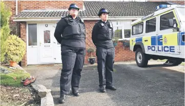  ??  ?? This file photo shows British Police Community Support Officers stand on duty outside a residentia­l property in Salisbury, southern England, believed to have been cordonned off in connection with the major incident which started at The Maltings...