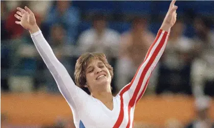  ?? Photograph: Lionel Cirroneau/AP ?? Mary Lou Retton celebrates her balance beam score at the 1984 Olympic Games in Los Angeles.