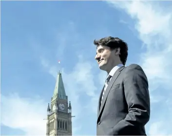  ?? ADRIAN WYLD/THE CANADIAN PRESS ?? Prime Minister Justin Trudeau leaves the stage after a flag raising ceremony on Parliament Hill in Ottawa last week.