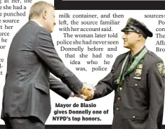  ??  ?? Mayor de Blasio gives Donnelly one of NYPD’s top honors.