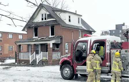  ?? FRANK GUNN/THE CANADIAN PRESS ?? Firefighte­rs pack up after responding to a house fire in Oshawa on Monday. Two adults and two children were killed in the fire that also sent three other people to hospital, fire officials said Monday.