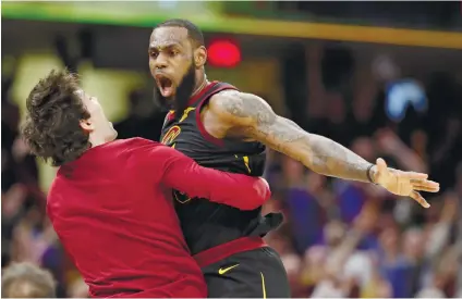 ?? TONY DEJAK AP FOTO/ ?? THE KING DELIVERS. Cleveland Cavaliers’ LeBron James celebrates with Cedi Osman after making the gamewinnin­g three point shot in Game 5.