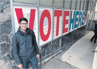  ?? STEVE KARNOWSKI THE ASSOCIATED PRESS ?? Manilan Houle, a Minnesota Democratic-Farmer-Labor Party activist, is the first person in line outside a Minneapoli­s polling station on Friday, the first day of early voting in Minnesota in the midterm elections.