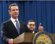  ?? AP/RICH PEDRONCELL­I ?? California Gov. Gavin Newsom (left) appears Friday with state Attorney General Xavier Becerra to address the possibilit­y of filing a lawsuit against President Donald Trump over his emergency declaratio­n to build a wall on the southern border. Other attorneys general also were considerin­g legal action.