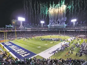  ?? Charles Krupa / Associated Press ?? Fireworks light up the sky at the conclusion of the Shamrock Series game as Notre Dame defeated Boston College at Fenway Park in Boston on Nov. 21, 2015. Yale will play Harvard in November at Fenway Park, for the 135th edition of the rivalry.