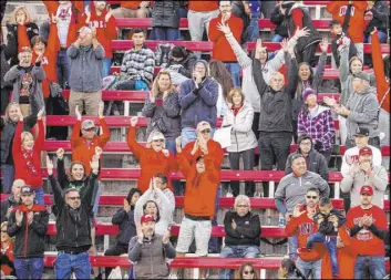  ??  ?? UNLV fans celebrate a late touchdown against San Jose State on Saturday at Sam Boyd Stadium. The Rebels’ last game at the facility drew about 10,000 fans.