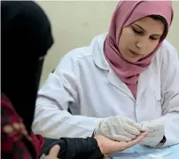  ??  ?? A doctor during a hepatitis C test in Cairo. — Reuters