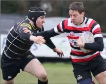  ??  ?? Enniscorth­y’s Richard Dunne evades a tackle from Kilkenny’s Hugh Lane during their league-winning game on Saturday.