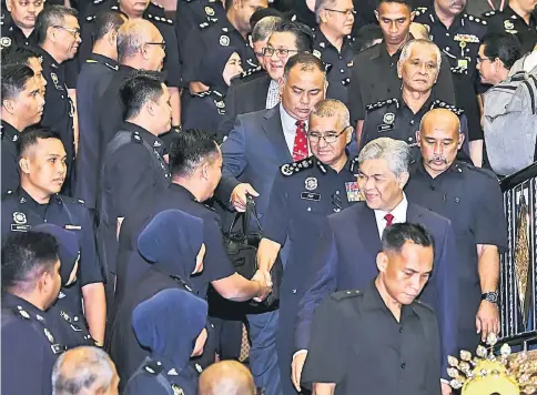  ??  ?? Ahmad Zahid at the meet-and-greet session with police personnel at PDRM College in Kuala Lumpur. Seen behind him is Inspector-General of Police Tan Sri Mohamad Fuzi Harun. —Bernama photo