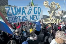 ?? HALDEN KROG/THE ASSOCIATED PRESS ?? Protesters call for the removal of president Jacob Zuma in a march on parliament in Cape Town, South Africa, on Monday. South Africa’s parliament will vote by secret ballot on a motion of no confidence on President Jacob Zuma on Tuesday.