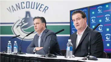  ?? —CPPHOTO ?? Canucks General Manager Jim Benning, right, shown with head coach Travis Green, says the team is faster this season, putting added pressure on opponents.