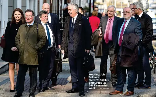 ??  ?? Meeting: John Delaney (centre) and his entourage at Dáil Éireann last week SPORTSFILE