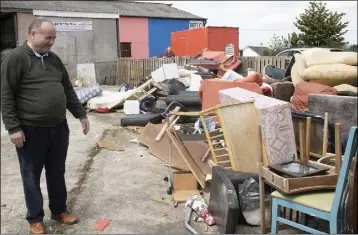  ??  ?? Bart Murphy with some of the rubbish he needs to get rid of from his Traceystow­n premises.