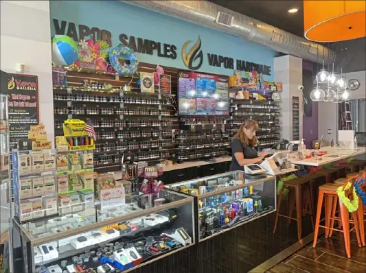  ?? Amanda Parrish/Post-Gazette ?? Pam McBurney, co-owner of Vapor Galleria, a franchise on the South Side, says local businesses struggle to get their products on social media and represente­d at local events in Pittsburgh.