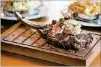  ?? CONTRIBUTE­D BY MIA YAKEL ?? Del Frisco’s Double Eagle Steakhouse Long-Bone Ribeye Wagyu Steak with crab.