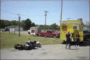  ?? IAN MAULE — TULSA WORLD VIA AP ?? News crews film at the scene of a fatal shooting Sunday at a Memorial Day event in Taft, Oklahoma.