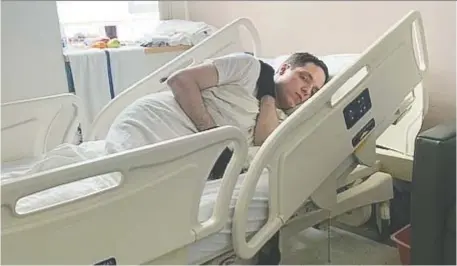  ?? FAMILY PHOTO ?? Jean-Marc Lang, 26, lays in his room on the secure psychiatri­c ward at the Ottawa Hospital Civic campus. He's been there since February while his family waits for the funding to move him into specialize­d residentia­l care. He hasn't been outside in nine months.