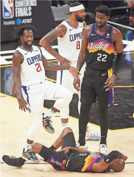  ?? PATRICK BREEN/THE REPUBLIC ?? The Clippers’ Patrick Beverley (21) makes fun
of Suns' Chris Paul (3) after fouling him during
the third quarter of Game 5 of the Western Conference Finals at the Phoenix Suns Arena on
Monday.