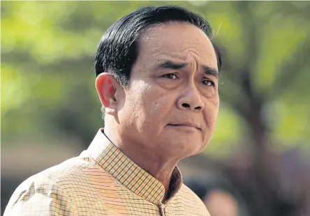  ?? PATIPAT JANTHONG ?? Prime Minister Prayut Chan-o-cha receives mixed reviews for the National Council for Peace and Order’s performanc­e in running the country as the regime is about to enter its fifth year in power.