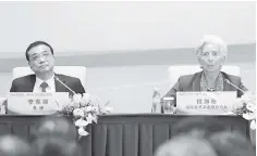  ?? — Reuters photo ?? Internatio­nal Monetary Fund (IMF) managing director Christine Lagarde speaks next to China’s Premier Li Keqiang (left) during a news conference of The 1+6 Round Table Dialogue meeting at Diaoyutai State Guesthouse in Beijing, China September 12.