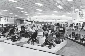  ?? TARGET ?? Select Target stores have revamped their baby department­s with lower shelves, displays of sample nurseries and areas where parents can test out products such as strollers and car seats.