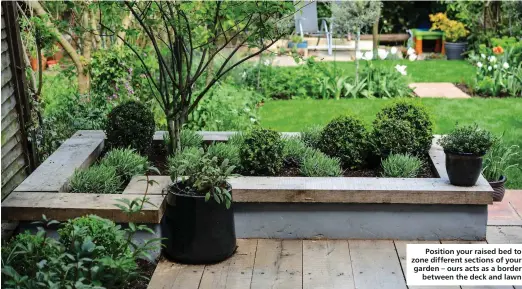  ??  ?? Position your raised bed to zone different sections of your garden – ours acts as a border
between the deck and lawn