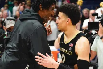  ?? CHRIS O’MEARA/AP ?? Vanderbilt guard Scotty Pippen Jr. celebrates with his father, Hall of Famer and former Bulls star Scottie Pippen, after the Commodores defeated Alabama in the SEC tournament in March.