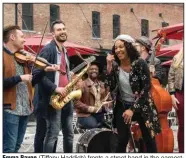  ??  ?? Emma Payge (Tiffany Haddish) fronts a street band in the earnestly feel-good comedy “Here Today,” directed by her co-star Billy Crystal.