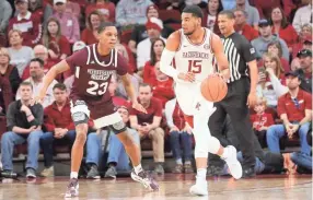  ?? NELSON CHENAULT/USA TODAY SPORTS ?? Arkansas guard Mason Jones (15) dribbles the ball in front of Mississipp­i State guard Tyson Carter on Saturday.