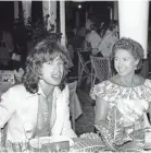  ?? JACQUES GUSTAVE/AFP/GETTY IMAGES ?? She chats in a restaurant in the French West Indies with Mick Jagger in 1976.