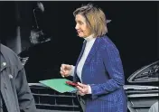  ?? AP ?? House Speaker Nancy Pelosi is escorted to a vehicle outside of her home in San Francisco, on Friday.