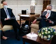  ?? Ap-evan Vucci ?? President Joe Biden meets with Senate Majority Leader Sen. Chuck Schumer of N.Y., and other Democratic lawmakers to discuss a coronaviru­s relief package, in the Oval Office of the White House, Wednesday, in Washington.