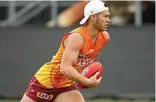  ?? PHOTO: MICHAEL WILLSON/ AFL MEDIA ?? NO FAVOURS: Cameron Rayner will have to earn his spot.