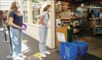  ??  ?? Kwon (right) her friend/partner Bass outside a shop ready to do some grocery shopping.