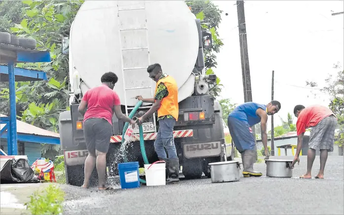  ?? Picture: JONACANI LALAKOBAU ?? Residents of Lami Village fill water buckets, pots and bottles during water disruption­s in the Lami area last year.