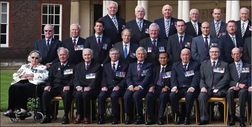  ??  ?? Britain’s bravest: The 43 recipients of the George Cross and George Medal gather in London to mark the 75th anniversar­y of the