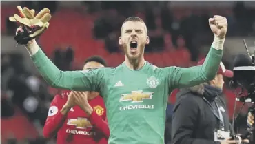  ??  ?? 0 Star man David De Gea celebrates Manchester United’s 1-0 victory over Tottenham at Wembley .