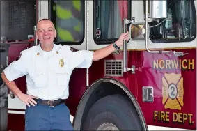  ?? SARAH GORDON/THE DAY ?? Tracy Montoya, a 27-year battalion chief named as the new fire chief of the Norwich Fire Department, poses for a photo on Thursday at the department.