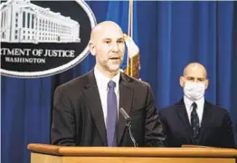 ?? SARAH SILBIGER AP ?? The FBI’s Steven D’Antuono speaks at Tuesday’s news conference. Michael Sher win, the acting U.S. attorney for the District of Columbia, is at right.