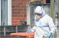  ?? Picture / AP ?? Investigat­ors were searching for clues at the property of Salman Abedi yesterday.