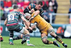  ??  ?? Power play: Nizaam Carr is held up by Leicester’s Hanro Liebenberg at Welford Road