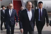  ?? RUSSIAN FOREIGN MINISTRY PRESS SERVICE VIA AP ?? Russia Foreign Minister Sergey Lavrov, center, arrives in Beijing on Monday before a meeting with China Foreign Minister Wang Yi.