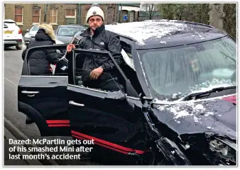  ?? ?? Dazed: McPartlin gets out of his smashed Mini after last month’s accident