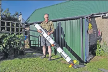  ?? 01_B25UAV01 ?? John Fitzpatric­k stands next to the £200,000 Royal Navy UAV discovered at Corriecrav­ie.