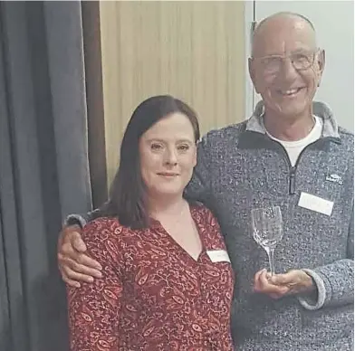  ?? ?? Mike Shaw with Worthing Samaritans director Fiona Cameron and the engraved goblet to mark his 50th year as a listening volunteer