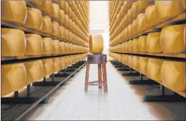  ?? Antonio Calanni The Associated Press ?? Parmigiano Reggiano Parmesan cheese wheels are stored Tuesday in Noceto, near Parma, Italy. U.S. consumers are snapping up the cheese ahead of a tariff hike.