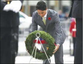  ?? CP PHOTO ?? Prime Minister Justin Trudeau lays a wreath at the National War Memorial in Ottawa on Tuesday during a ceremony in honour of the 75th anniversar­y of the Dieppe Raid.